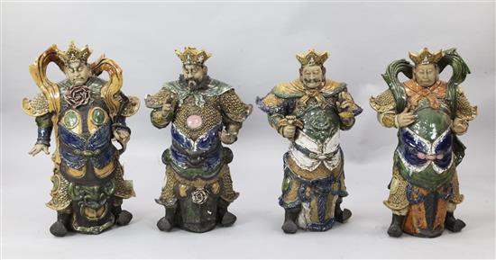 A set of four large Cantonese polychrome stoneware figures of the Four Heavenly Kings, tallest 77cm, lacking attributes